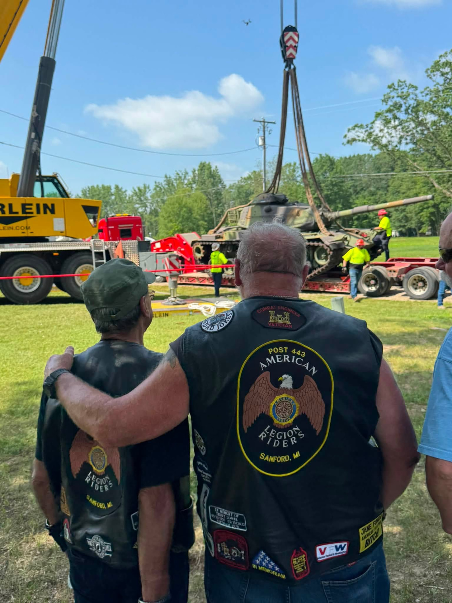 Vietnam veterans from Sanford American Legion Riders Chapter #443 look on as the Vietnam-era tank is placed at Post #443