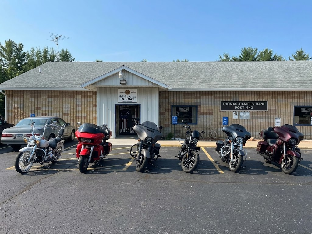 Thomas-Daniels-Hand American Legion Post #443 building with motorcycles parked in front under a blue sky
